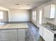 Open concept kitchen with island and granite countertops at 201 S Apache Ave, Eloy, AZ 85131