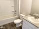 Clean bathroom with a shower/tub combo and granite vanity at 201 S Apache Ave, Eloy, AZ 85131