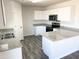 L-shaped kitchen, granite counters, and stainless steel appliances at 201 S Apache Ave, Eloy, AZ 85131