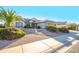 Single story home with attached two car garage and desert landscaping at 18483 N Deer Grass Ct, Surprise, AZ 85374
