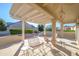 Covered patio with seating area and ceiling fan at 18483 N Deer Grass Ct, Surprise, AZ 85374