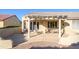 Covered patio with seating area, perfect for outdoor entertaining at 18483 N Deer Grass Ct, Surprise, AZ 85374