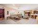 Open living room with comfortable seating and views to kitchen at 18483 N Deer Grass Ct, Surprise, AZ 85374