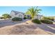Single story home with attached two car garage and desert landscaping at 18483 N Deer Grass Ct, Surprise, AZ 85374