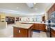 Spacious kitchen featuring granite countertops, ample cabinetry, and an island at 18483 N Deer Grass Ct, Surprise, AZ 85374