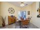 Bright dining room with wood table and chairs at 18483 N Deer Grass Ct, Surprise, AZ 85374