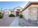 Inviting entryway with walkway and stone accents at 18483 N Deer Grass Ct, Surprise, AZ 85374