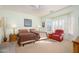 Bright bedroom with two twin beds, window seating, and ample natural light at 18483 N Deer Grass Ct, Surprise, AZ 85374