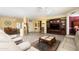 Bright and airy living room featuring a large entertainment center at 18483 N Deer Grass Ct, Surprise, AZ 85374