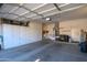 Garage with ample storage space and overhead shelving at 18483 N Deer Grass Ct, Surprise, AZ 85374