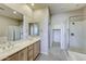 Bathroom with double vanity, shower, and separate tub at 20750 N 87Th St # 2062, Scottsdale, AZ 85255