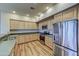 Modern kitchen with stainless steel appliances and light wood cabinets at 20750 N 87Th St # 2062, Scottsdale, AZ 85255