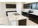 Modern kitchen with dark cabinets and marble countertops at 1988 W Cameron Blvd, Coolidge, AZ 85128