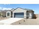 One-story home with gray exterior and blue garage door at 1988 W Cameron Blvd, Coolidge, AZ 85128