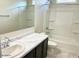 Clean bathroom with a single sink vanity, a bathtub, and shower at 1988 W Cameron Blvd, Coolidge, AZ 85128