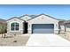 One-story home with gray exterior and blue garage door at 1988 W Cameron Blvd, Coolidge, AZ 85128