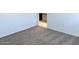 Bright bedroom with neutral carpeting and ample closet space at 1988 W Cameron Blvd, Coolidge, AZ 85128