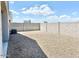 Large backyard with gravel and a block wall for privacy at 1988 W Cameron Blvd, Coolidge, AZ 85128