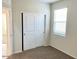 Well-lit bedroom featuring a double door closet and neutral carpeting at 1988 W Cameron Blvd, Coolidge, AZ 85128