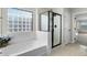 Bathroom with soaking tub, shower, and view of bedroom at 3535 E Melody Ln, Gilbert, AZ 85234