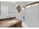 Clean bathroom with granite vanity, bathtub, and updated fixtures at 3535 E Melody Ln, Gilbert, AZ 85234