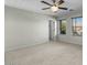 Spacious bedroom with ceiling fan and carpet at 3535 E Melody Ln, Gilbert, AZ 85234