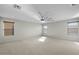 Large bedroom with ceiling fan and carpet flooring and lots of natural light at 3535 E Melody Ln, Gilbert, AZ 85234