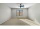 Bright bedroom with ceiling fan and carpet flooring at 3535 E Melody Ln, Gilbert, AZ 85234