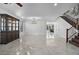 Bright dining room with hardwood floors, large windows, and a staircase at 3535 E Melody Ln, Gilbert, AZ 85234