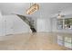 Open concept dining room with tile floors and a modern light fixture at 3535 E Melody Ln, Gilbert, AZ 85234