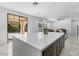 Modern kitchen with a large island, stainless steel appliances, and white cabinets at 3535 E Melody Ln, Gilbert, AZ 85234