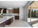 Kitchen features a large island, white quartz countertops, and access to the backyard at 3535 E Melody Ln, Gilbert, AZ 85234