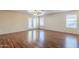 Living room with hardwood floors and access to a patio at 42340 W Oakland Dr, Maricopa, AZ 85138