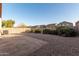Backyard with gravel, patio, and a fence at 813 E Lovegrass Dr, San Tan Valley, AZ 85143