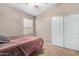 Simple bedroom with a full-size bed and double-door closet at 813 E Lovegrass Dr, San Tan Valley, AZ 85143
