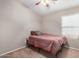 Cozy bedroom with a full-size bed and ceiling fan at 813 E Lovegrass Dr, San Tan Valley, AZ 85143