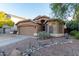 Well-maintained single-story home with landscaping at 813 E Lovegrass Dr, San Tan Valley, AZ 85143