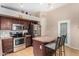 Kitchen with stainless steel appliances and wood cabinets at 813 E Lovegrass Dr, San Tan Valley, AZ 85143