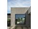 Contemporary exterior with large window and concrete wall at 5939 E Orange Blossom Ln, Phoenix, AZ 85018