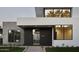 Modern home exterior with concrete and dark wood accents at 5939 E Orange Blossom Ln, Phoenix, AZ 85018