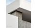 Architectural detail of modern home showing concrete and white walls at 5939 E Orange Blossom Ln, Phoenix, AZ 85018