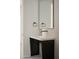 Modern bathroom with floating vanity and large mirror at 5939 E Orange Blossom Ln, Phoenix, AZ 85018