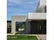 Contemporary home exterior with concrete and white accents at 5939 E Orange Blossom Ln, Phoenix, AZ 85018