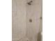 Clean shower with marble-style tile and pebble floor at 1942 S Emerson -- # 131, Mesa, AZ 85210