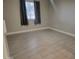 Well-lit bedroom featuring gray tile floors and window coverings at 1942 S Emerson -- # 131, Mesa, AZ 85210