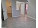 Bright bedroom with gray tile flooring, and access to bath and closet at 1942 S Emerson -- # 131, Mesa, AZ 85210