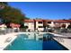 Community pool area with ample lounge chairs at 1942 S Emerson -- # 131, Mesa, AZ 85210