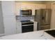 Kitchen with stainless steel appliances and white cabinets at 1942 S Emerson -- # 131, Mesa, AZ 85210