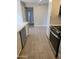 Open kitchen with stainless steel appliances and an island at 1942 S Emerson -- # 131, Mesa, AZ 85210