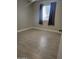 Bright bedroom with gray tile flooring and window coverings at 1942 S Emerson -- # 131, Mesa, AZ 85210